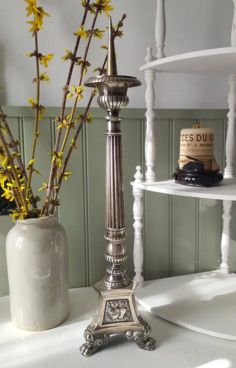 Old church candlestick in silver-plated metal