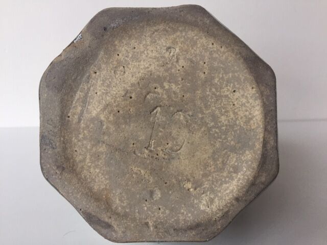 Ancient amphora vase in sand