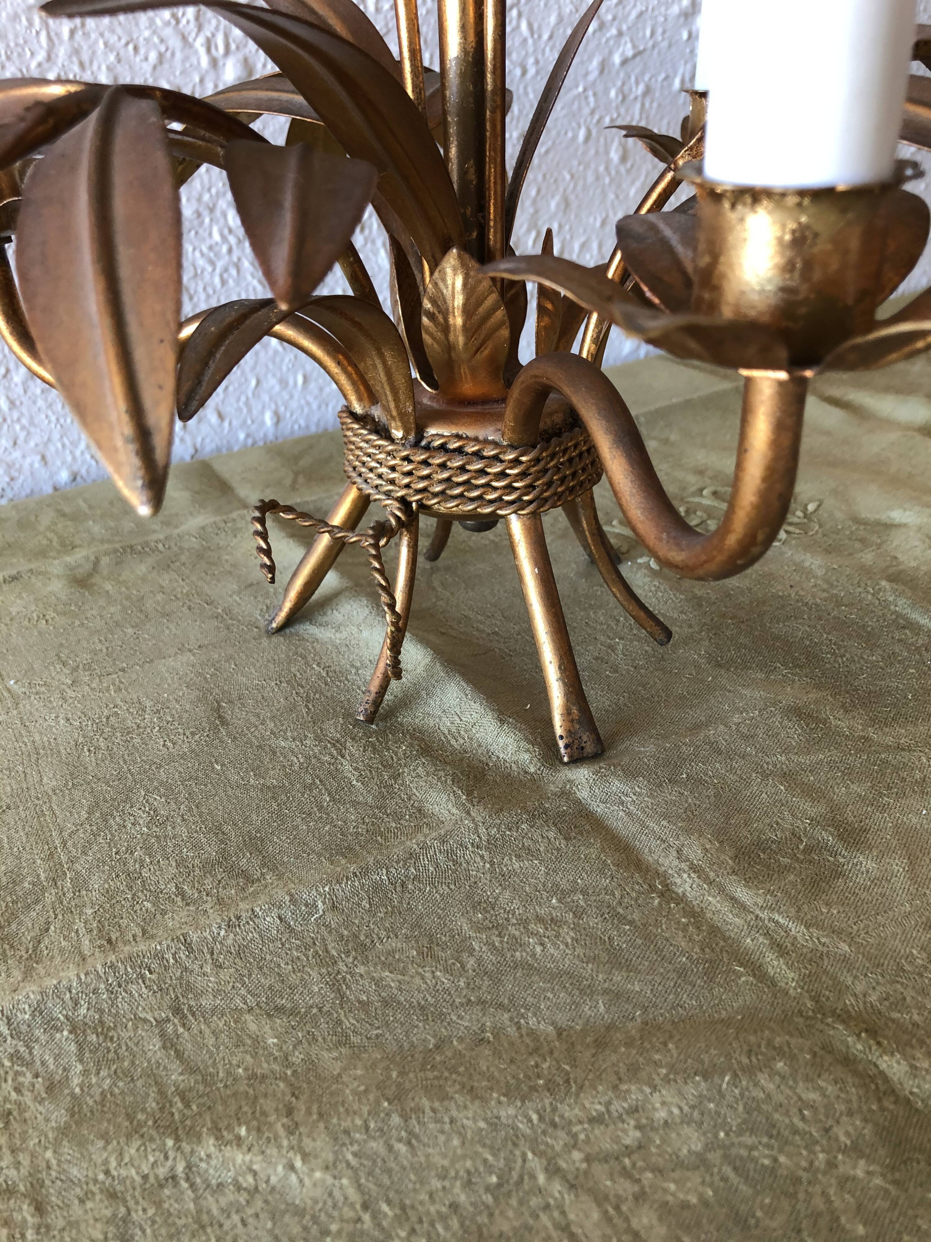 Golden vintage chandelier with leaf decoration