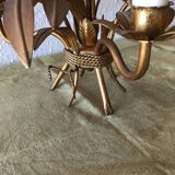 Golden vintage chandelier with leaf decoration
