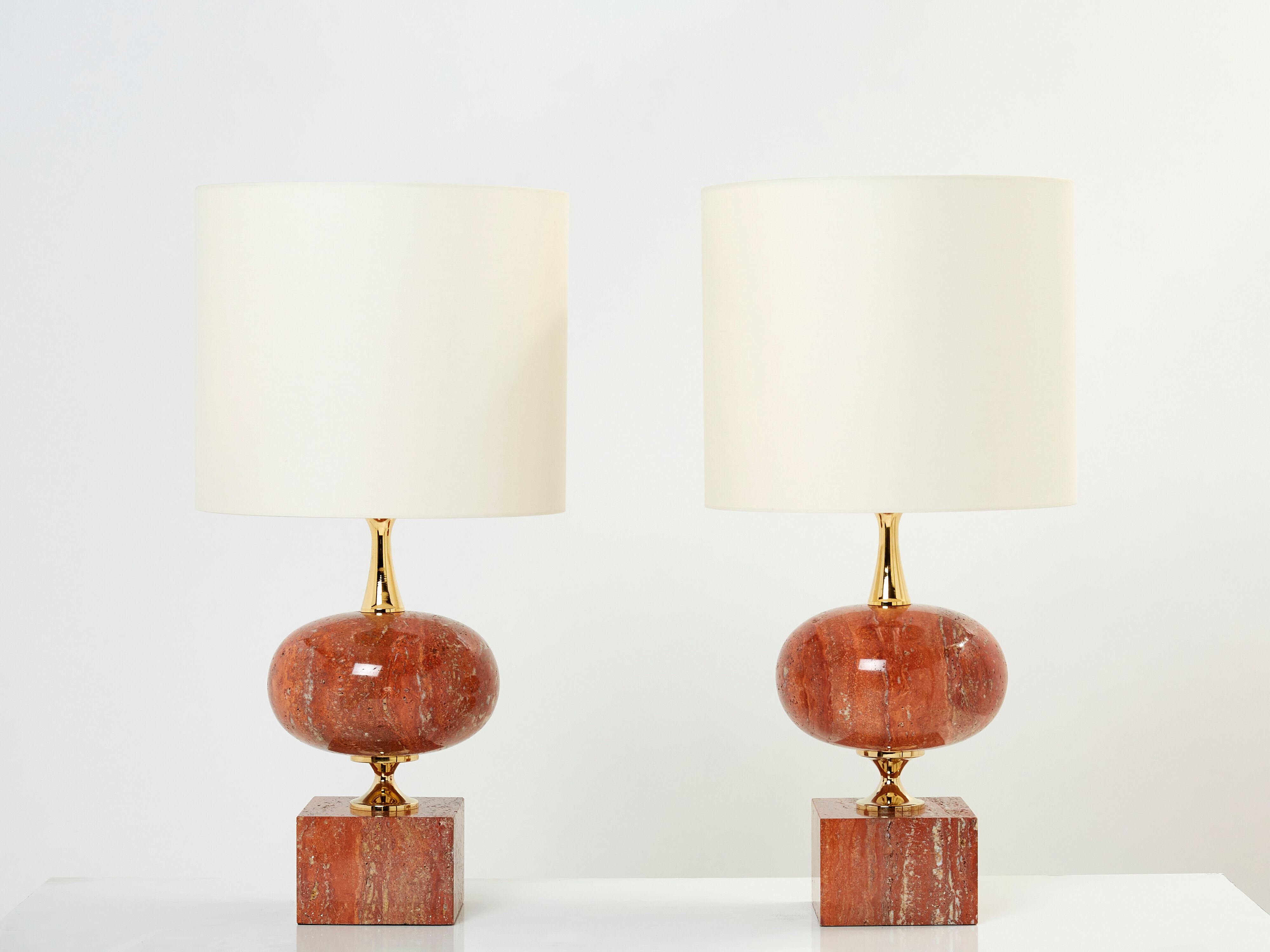 Pair of lamps in red travertine and brass 1970