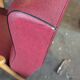 Fauteuil vintage piétement compas skaï rouge