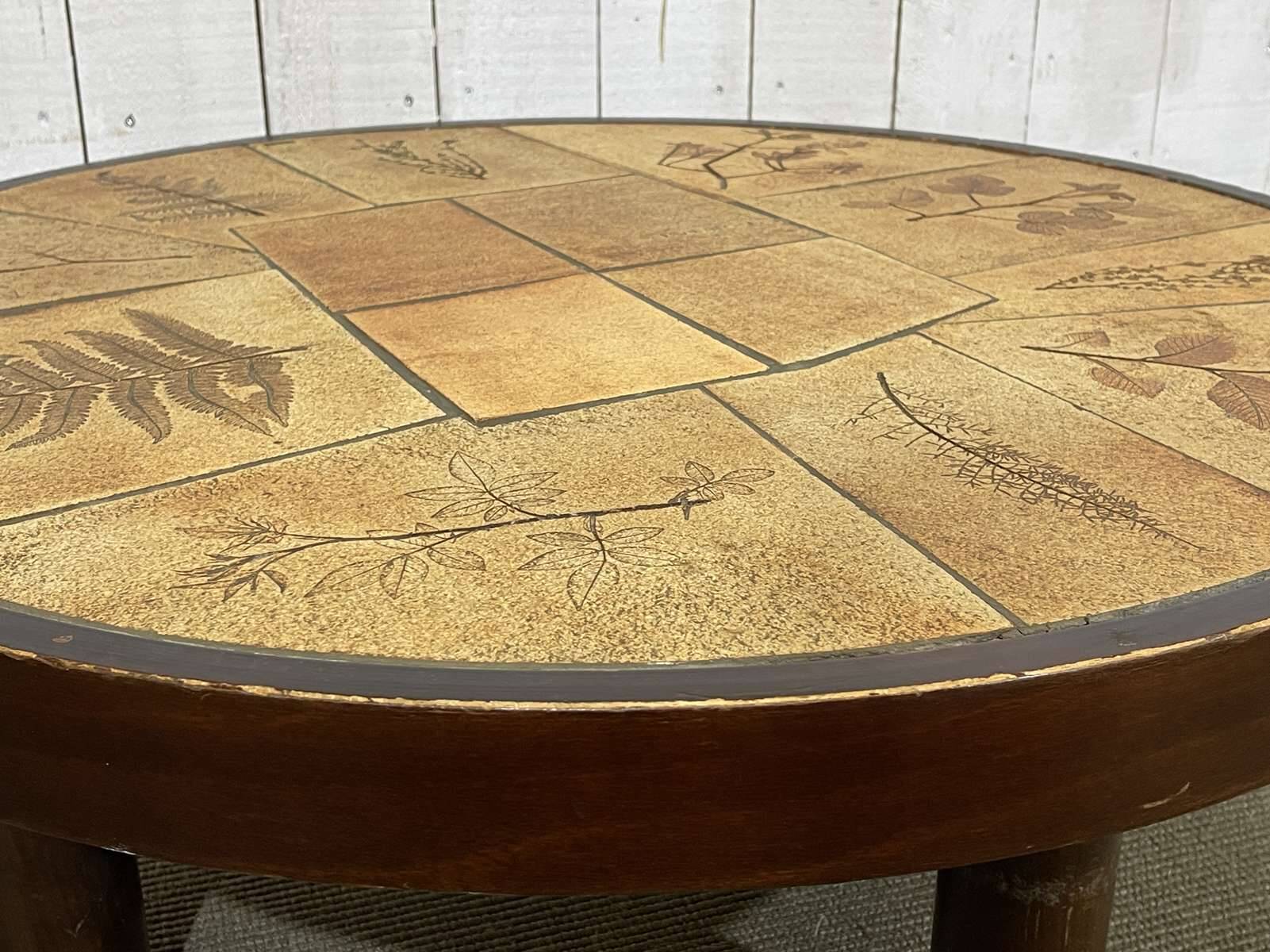 Beech coffee table with a ceramic top featuring a herbarium design.
