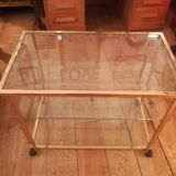 Trolley on wheels in gilded brass and beveled glass