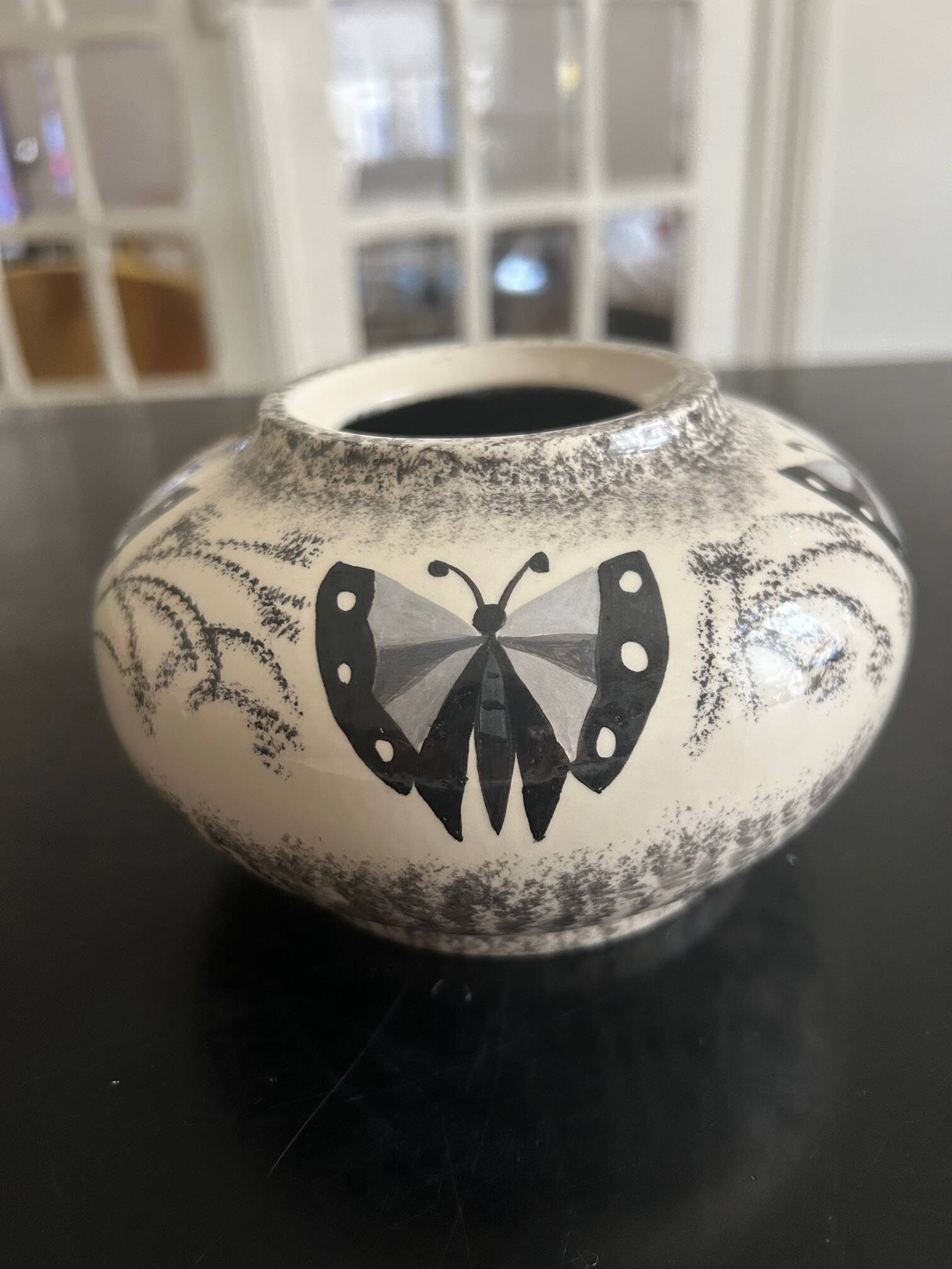 ceramic vase decorated by the artist René Poirot