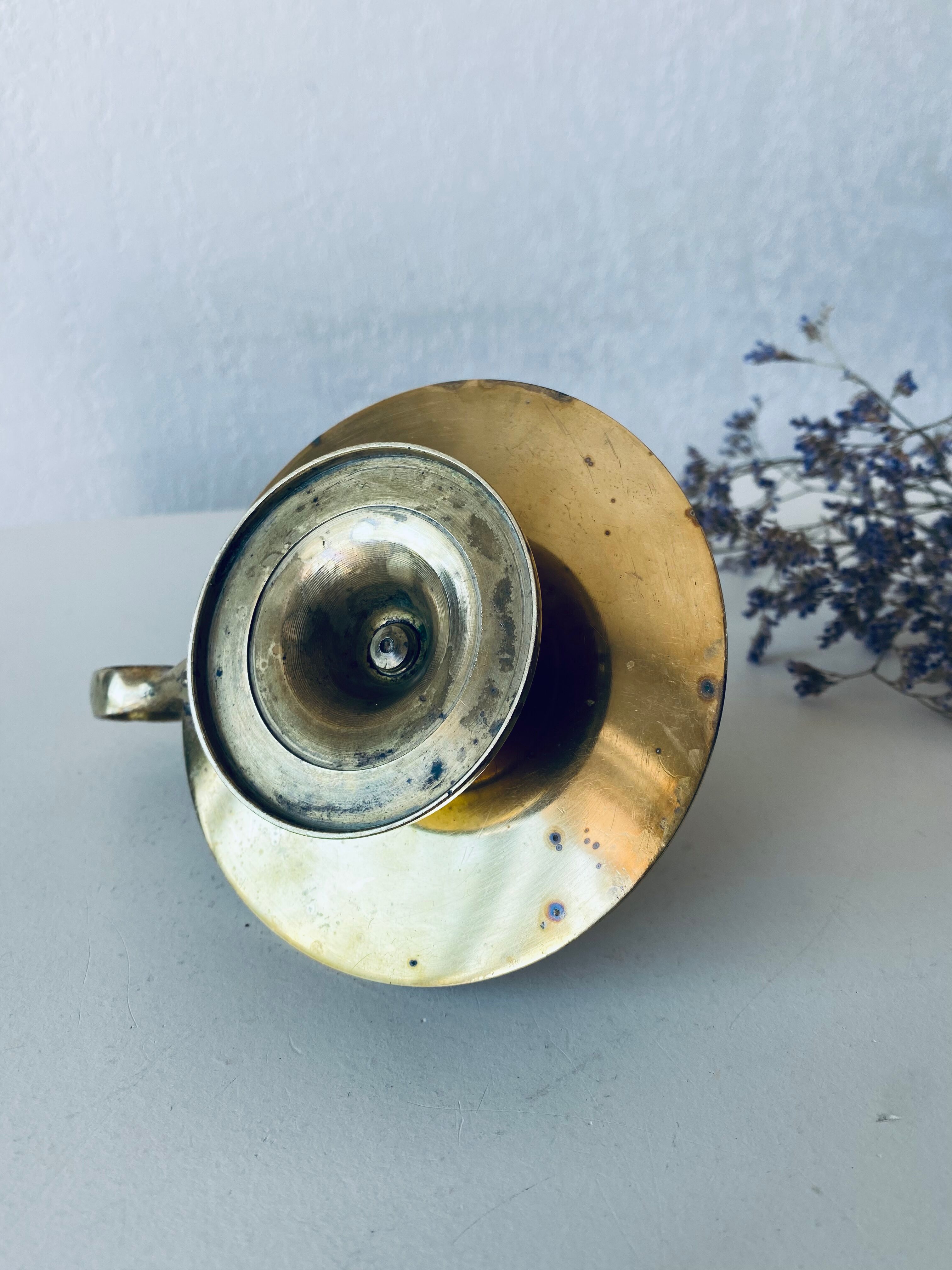 Old candle holder with handle