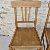 Pair of bistro chairs with perforated seat