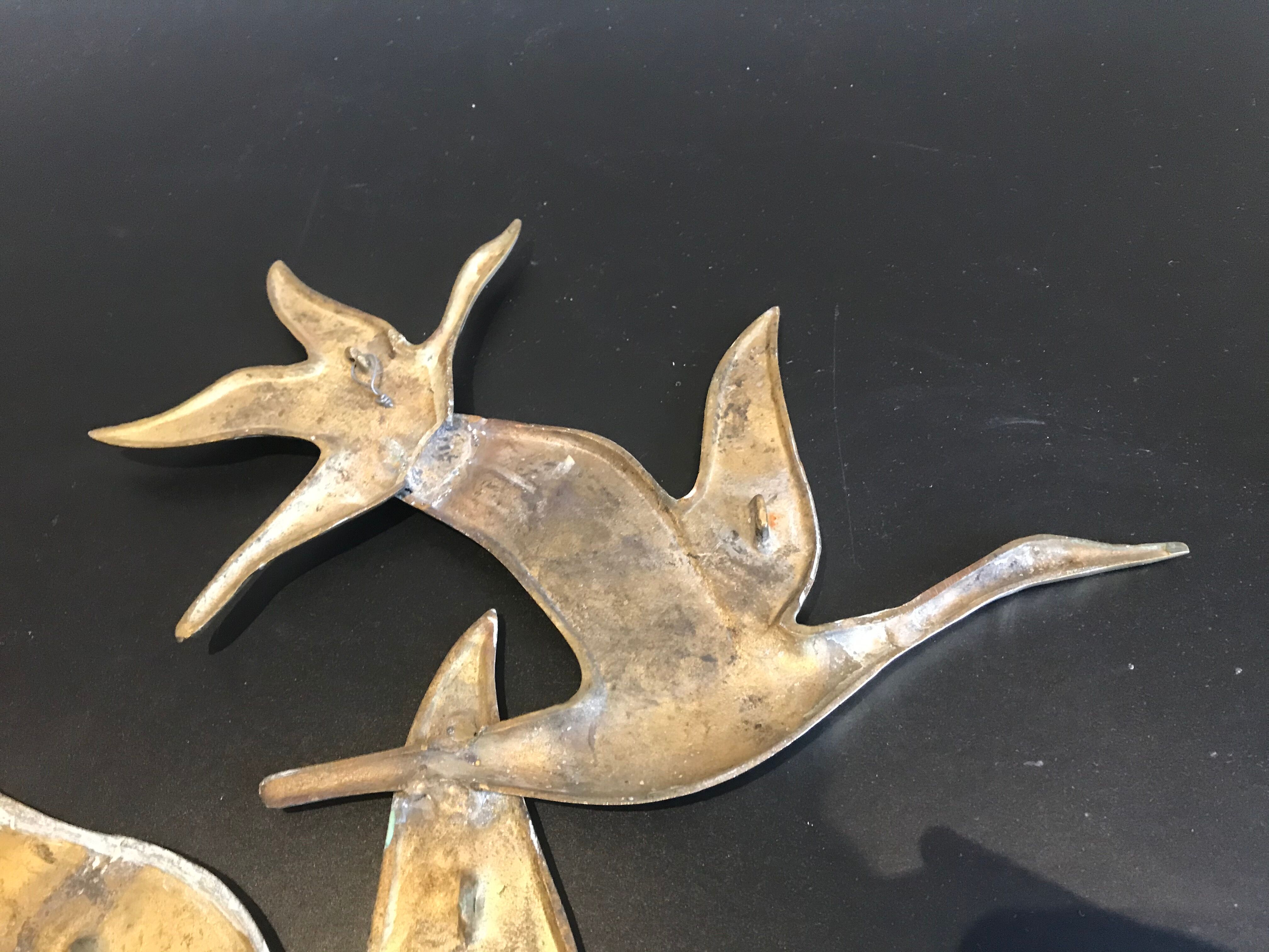 Birds in brass flight