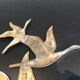 Birds in brass flight