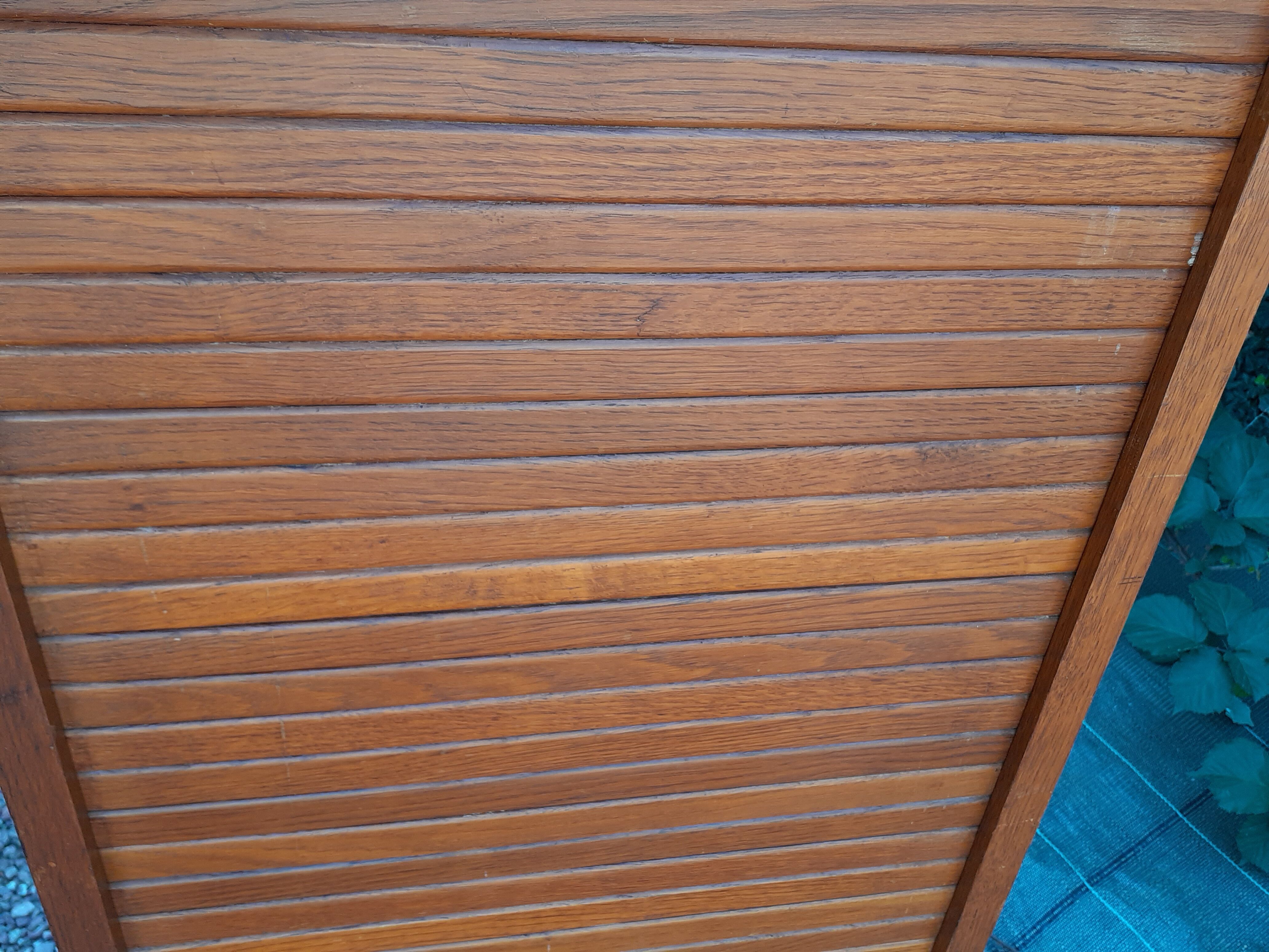 Storage cabinet locker with old wooden curtain