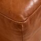 Ottoman with leather upholstery