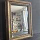 Miniature mirror from the 18th century in gilded wood, mercury glass.