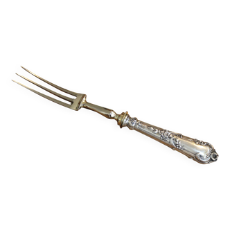A silver leg of lamb service including a fork and a knife