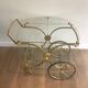 Neo classical style table in silver and gold metal and glass