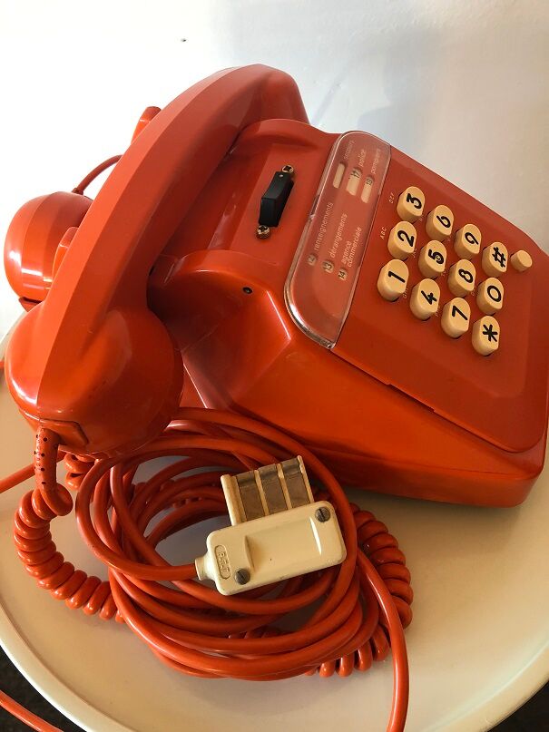 Orange Socotel phone with keys from the 70s 80s