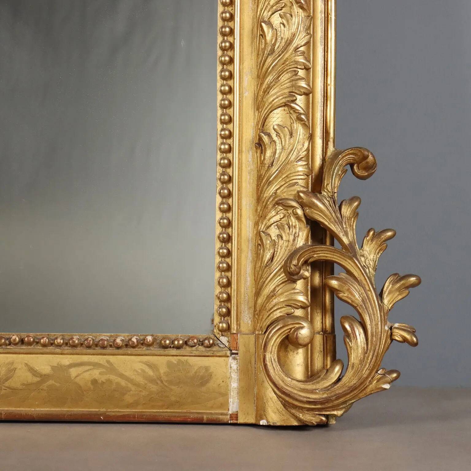 Antique eclectic style mirror in carved and gilded fir, Italy, 19th century.