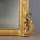 Antique eclectic style mirror in carved and gilded fir, Italy, 19th century.