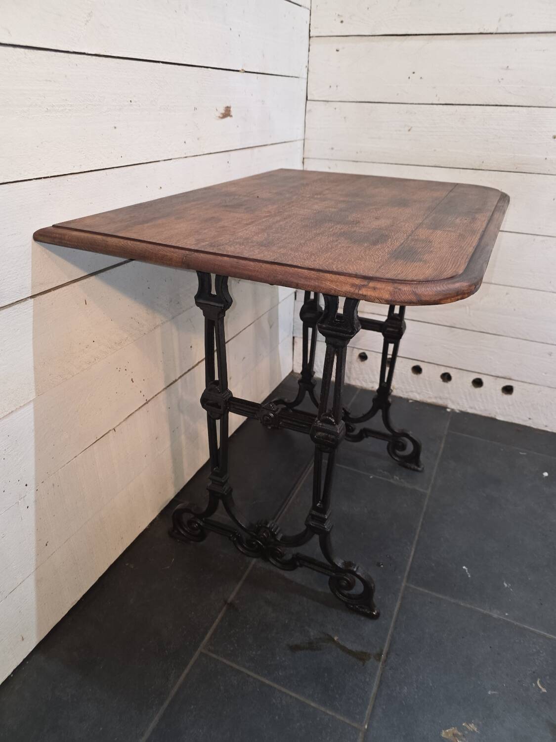 Bistro table with cast iron legs and oak top