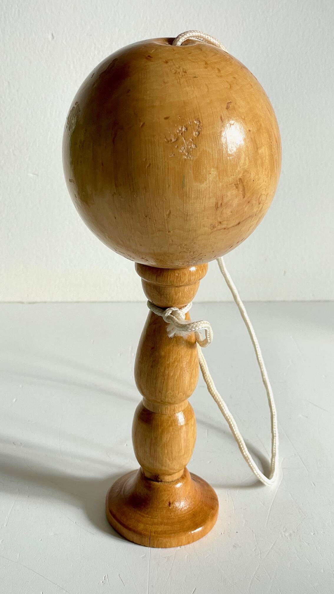 Vintage wooden cup-and-ball toy