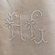Drap en metis monogramme HG.