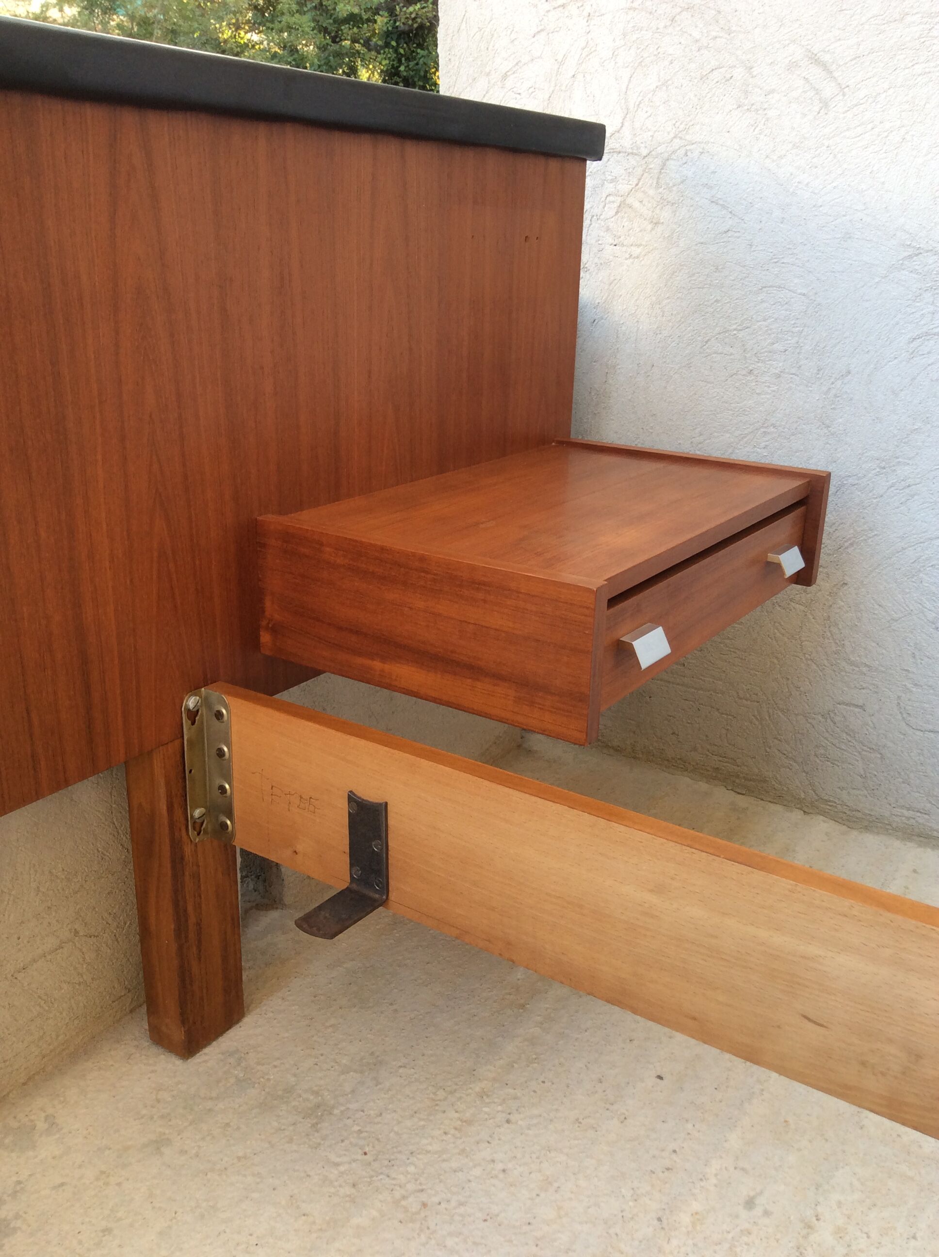 Scandinavian-style teak bed with integrated nightstands