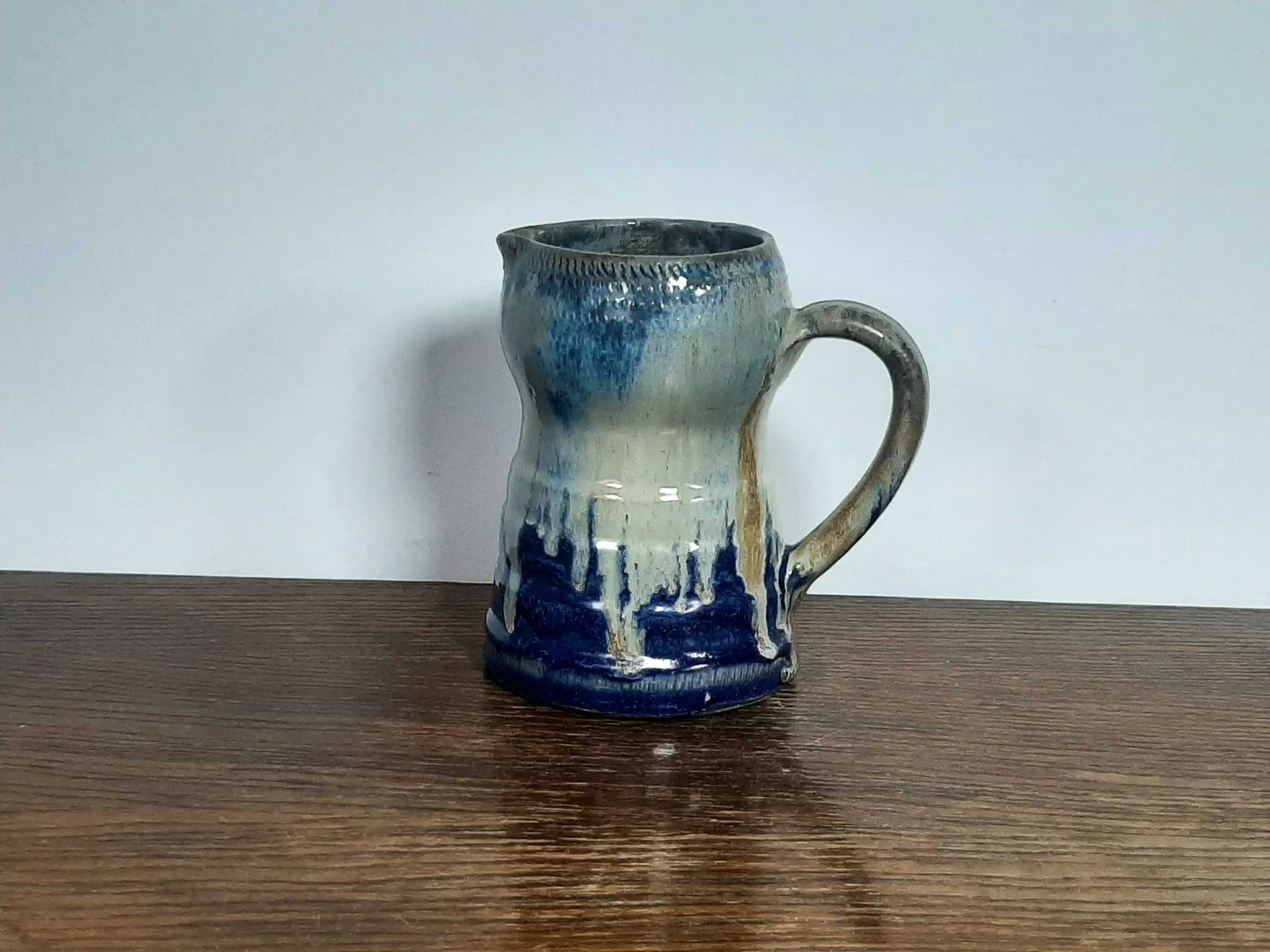 Blue flamed stoneware jug