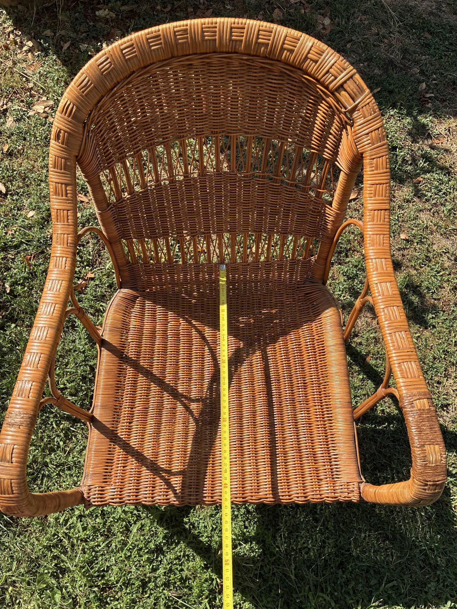 Vintage colonial lounge chair in rattan, pre-1950s.