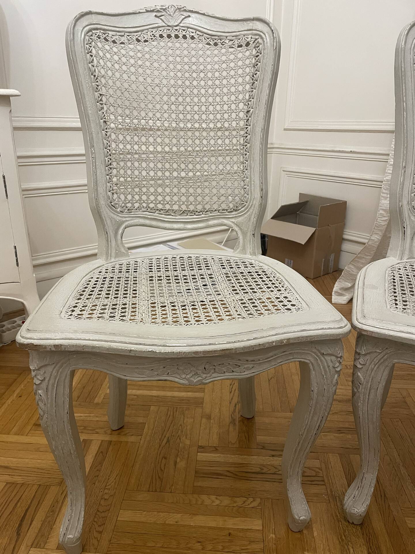 Set of 4 white caned chairs in Louis XV style.