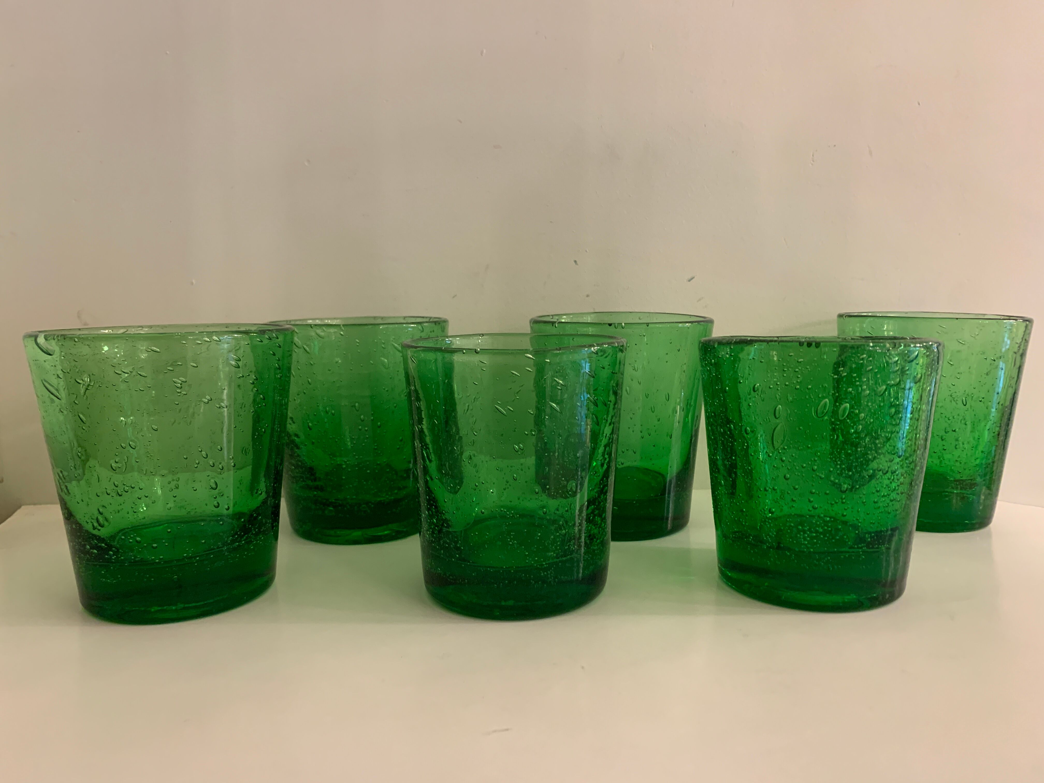 6 green whiskey glasses, bubbles and Biot soufflés