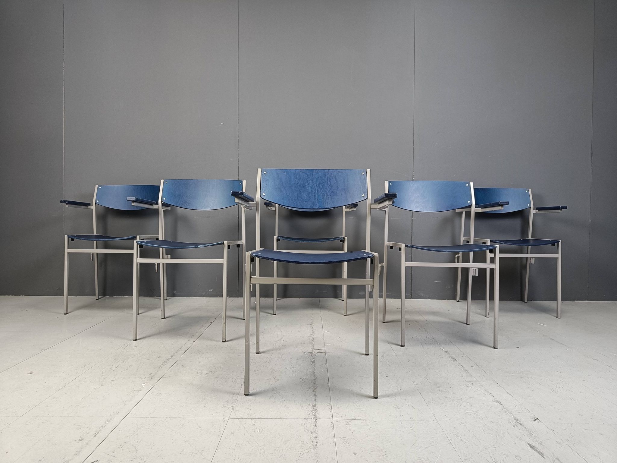 Minimalist metal and plywood stackable armchairs by Gijs Van Der Sluis