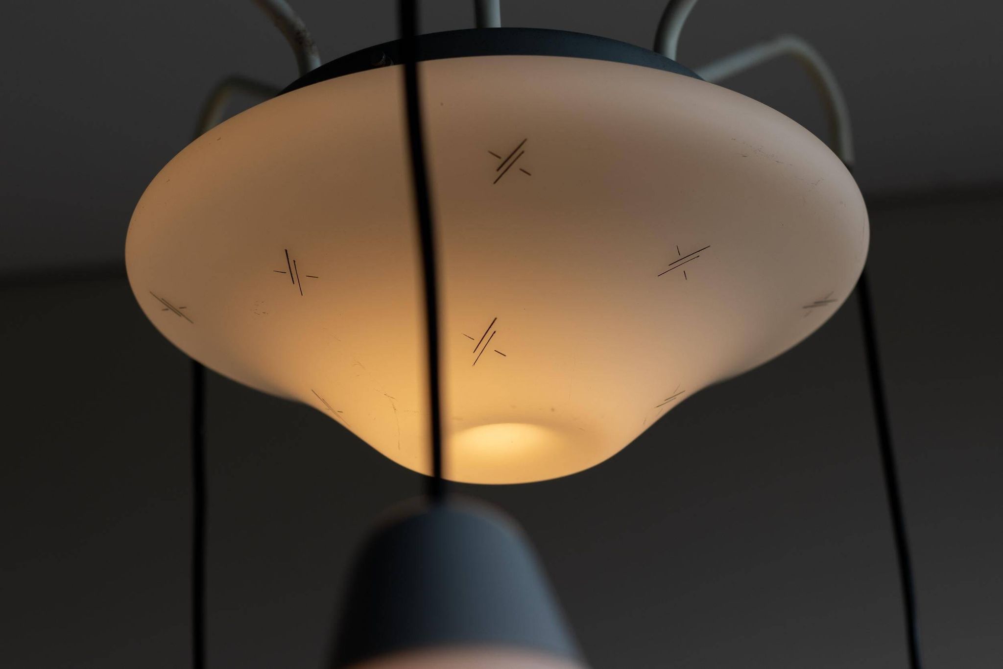 Italian brass enamelled grey chandelier with frosted glass pendants, circa 1960.