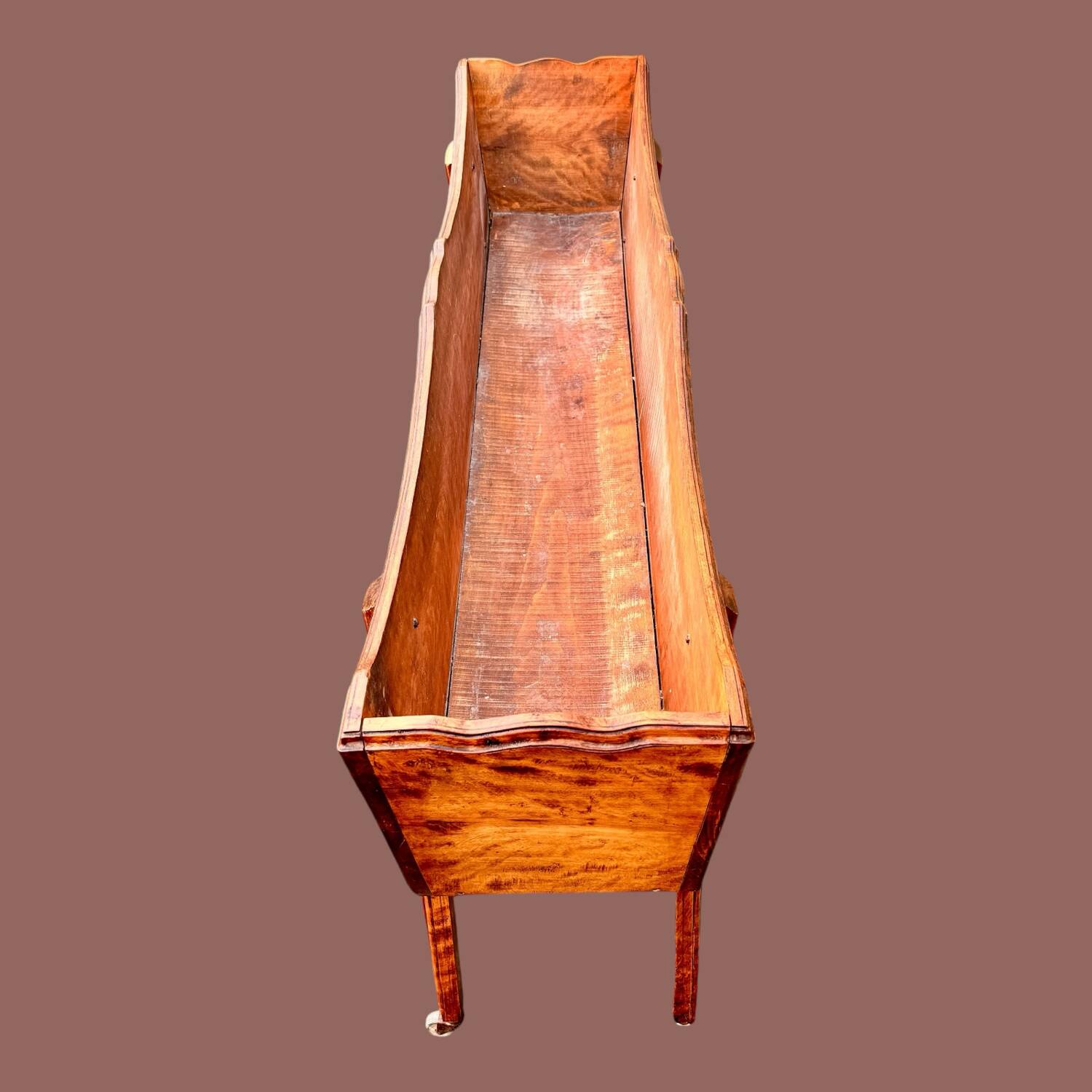 Old indoor planter on wheels