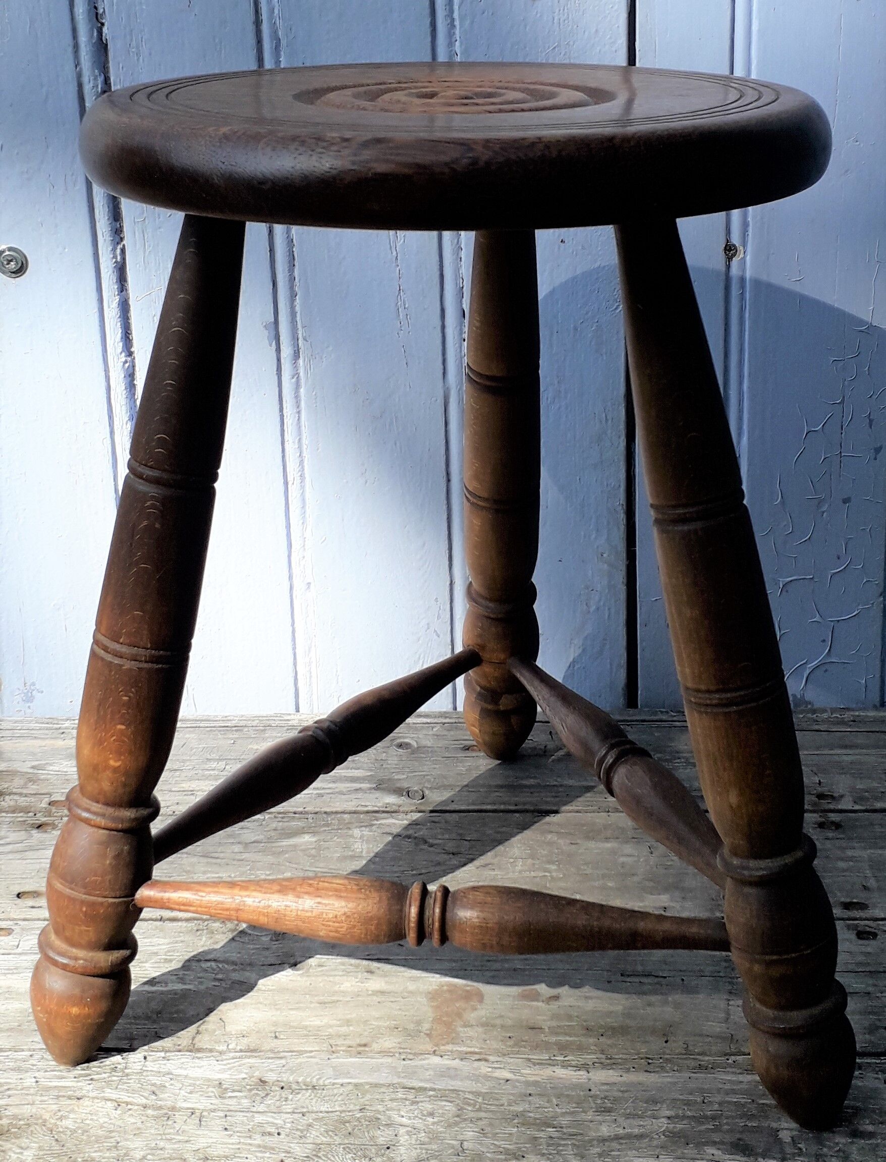 Wooden tripod stool