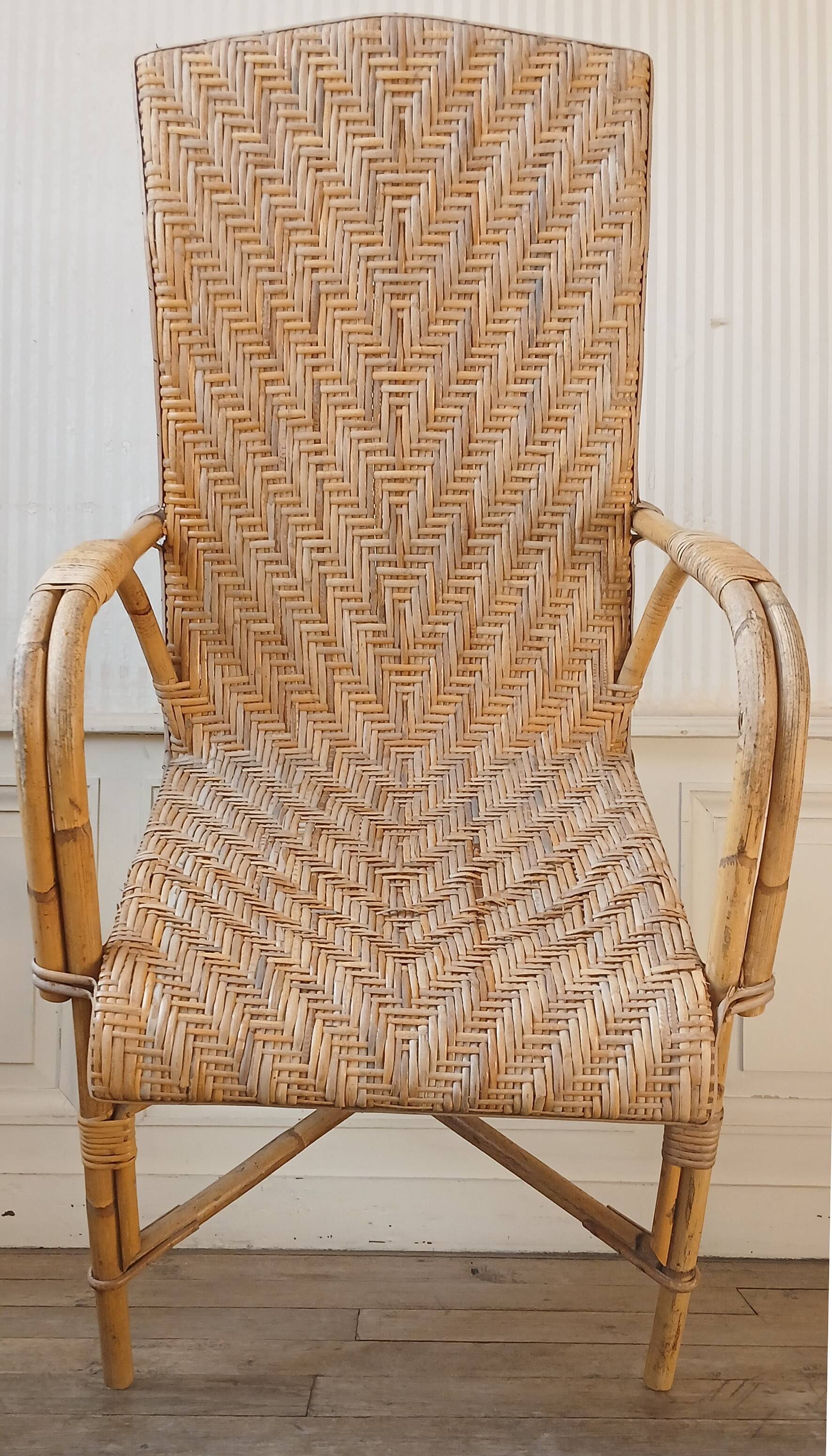 High-backed adult rattan armchair, circa 1960