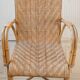 High-backed adult rattan armchair, circa 1960