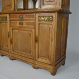 Art Nouveau oak buffet and dinanderie panels, circa 1910
