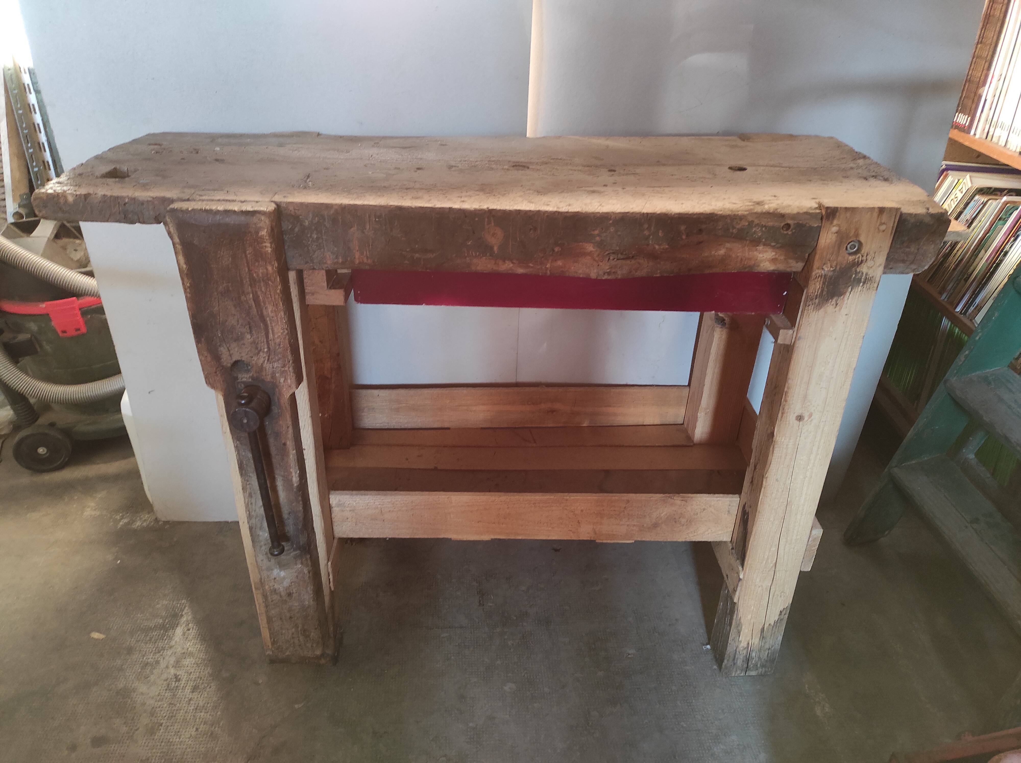 Old homemade vintage solid wood workbench with press and drawer