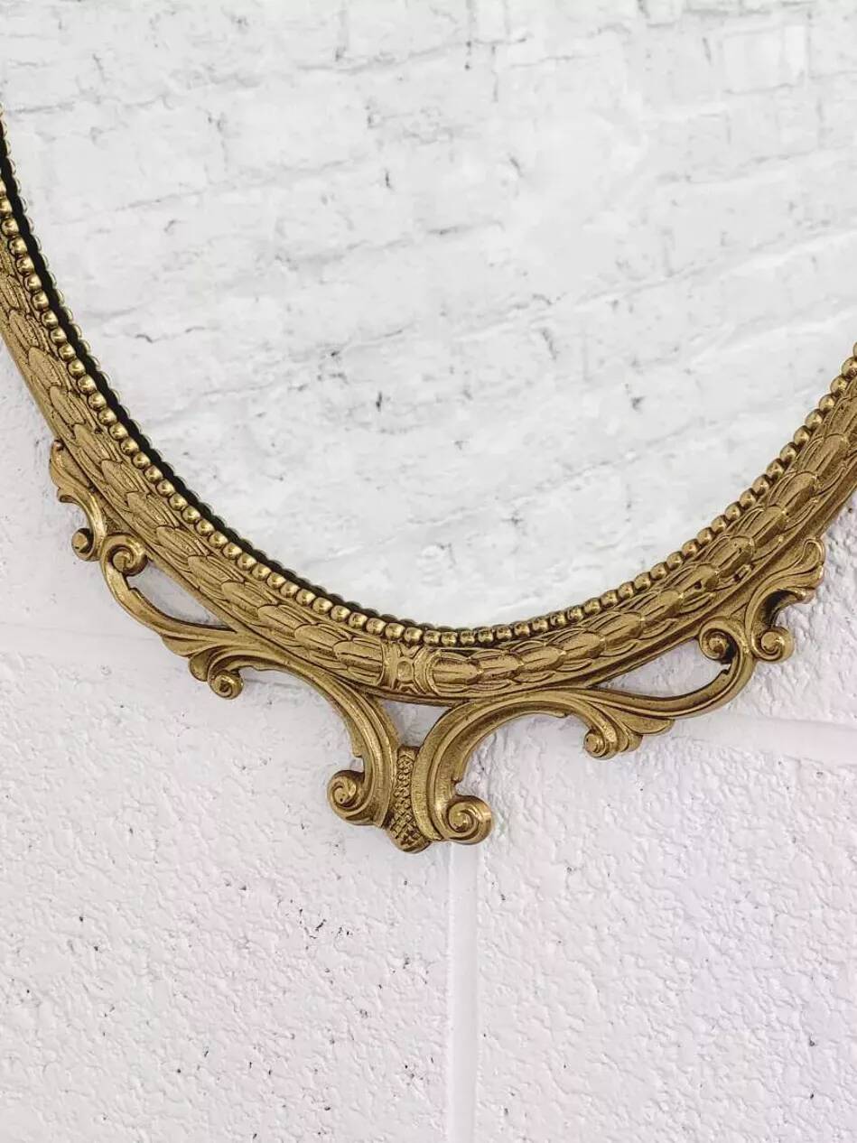 Italian oval brass medallion mirror