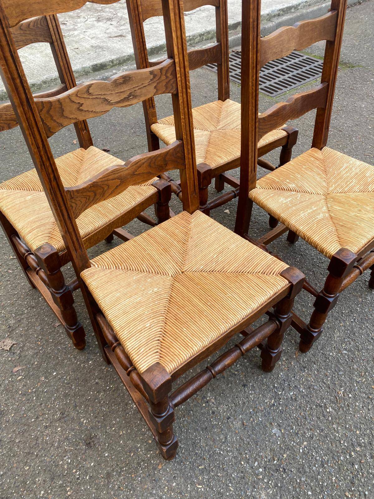 4 solid wood chairs with straw seats and high backs, 108cm.