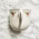 Teacup on its saucer and porcelain cake plate