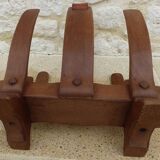 Unique piece of a magazine rack or log rack in solid oak pegged with leather handle