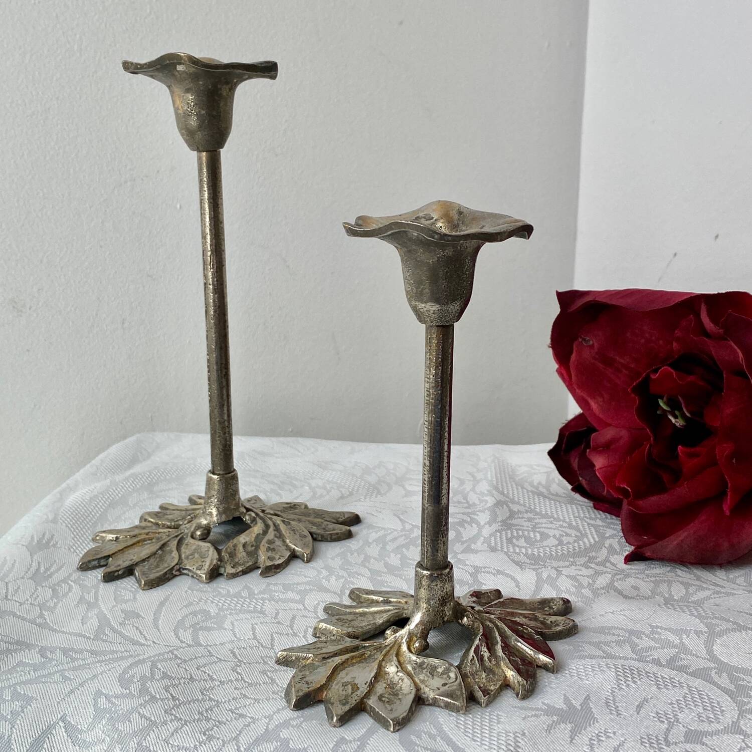 Pair of metal flower candlesticks