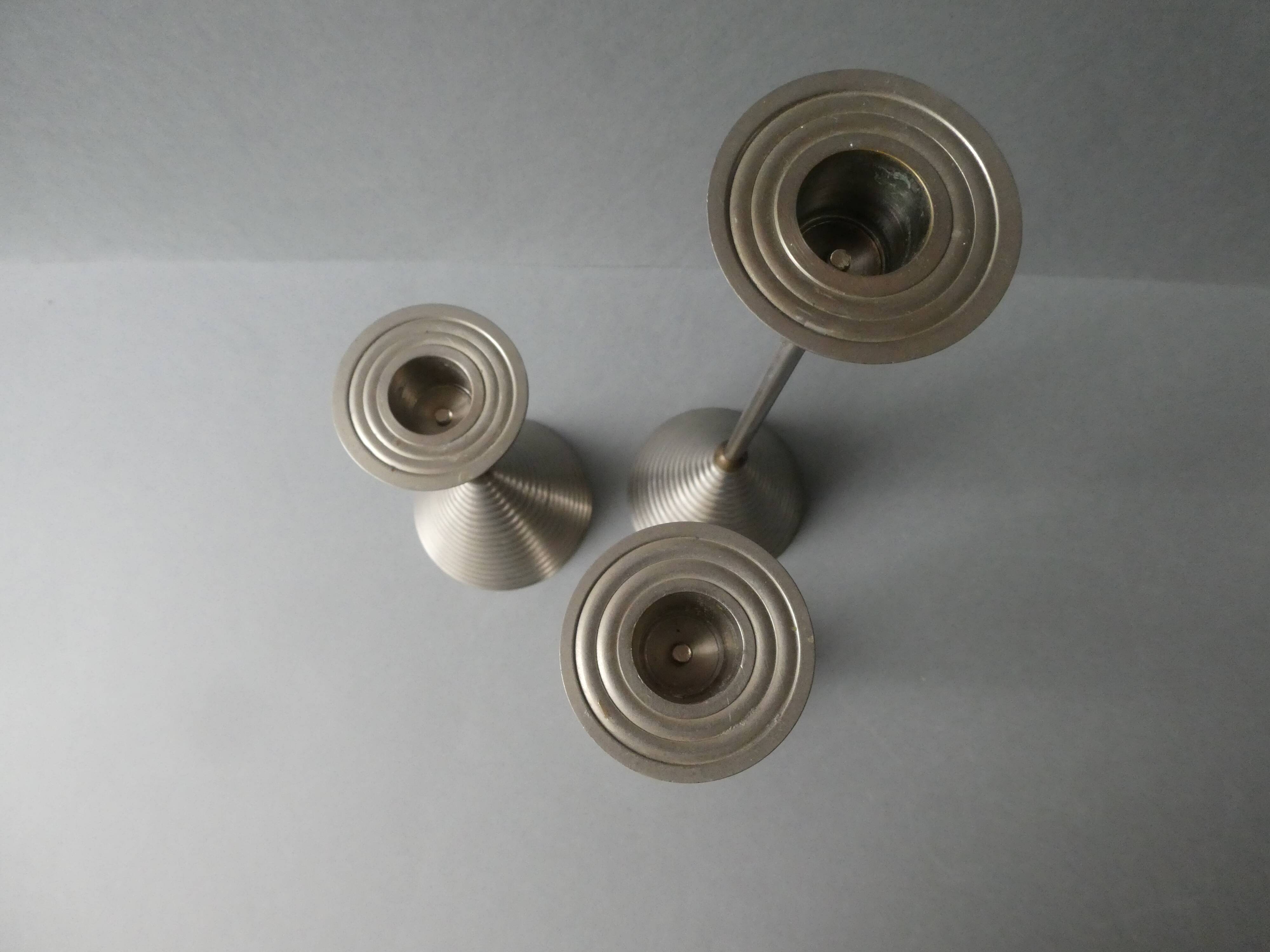 3 bougeoirs en métal argenté et doré