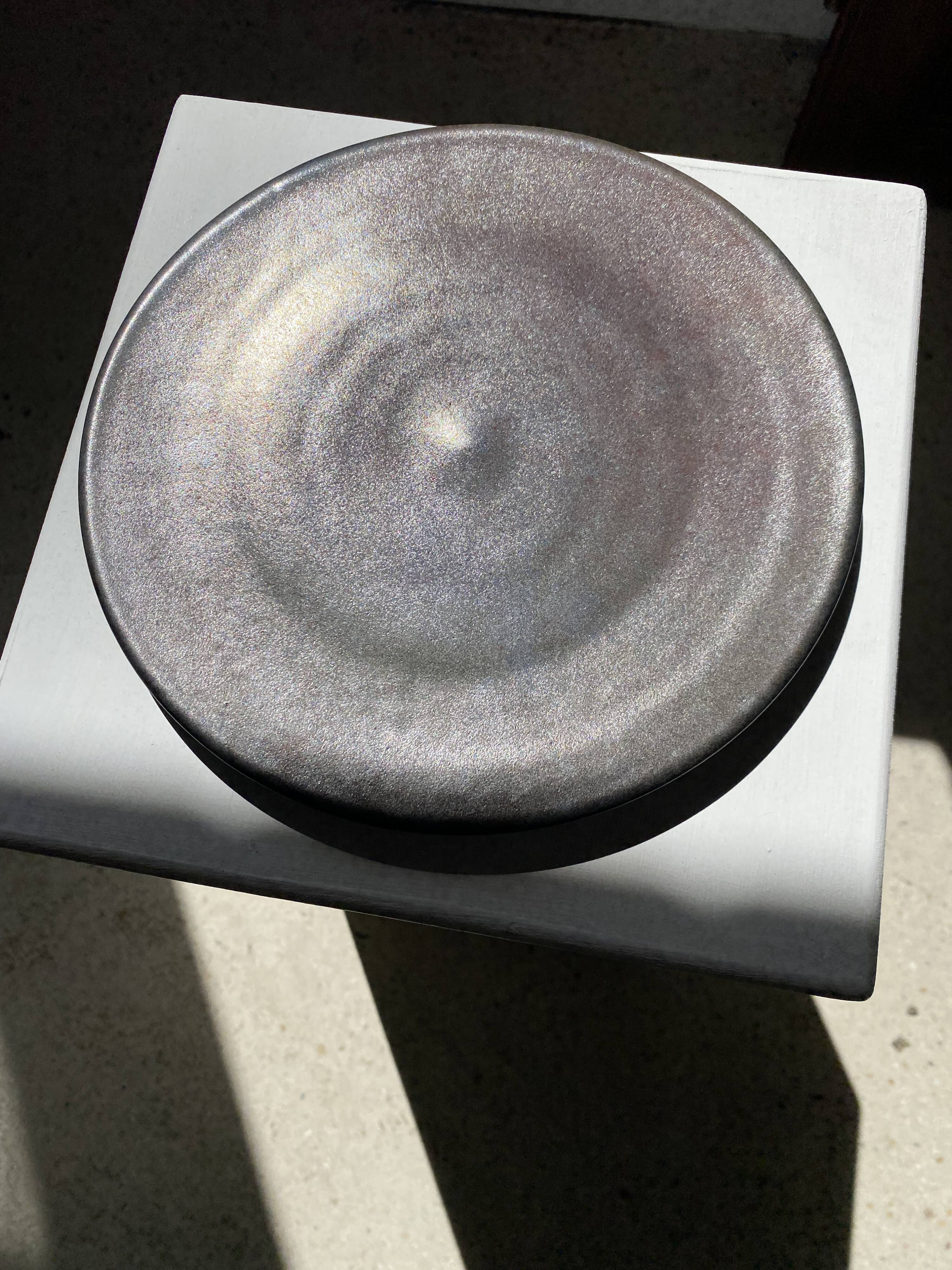 Series of 7 brown ceramic plates