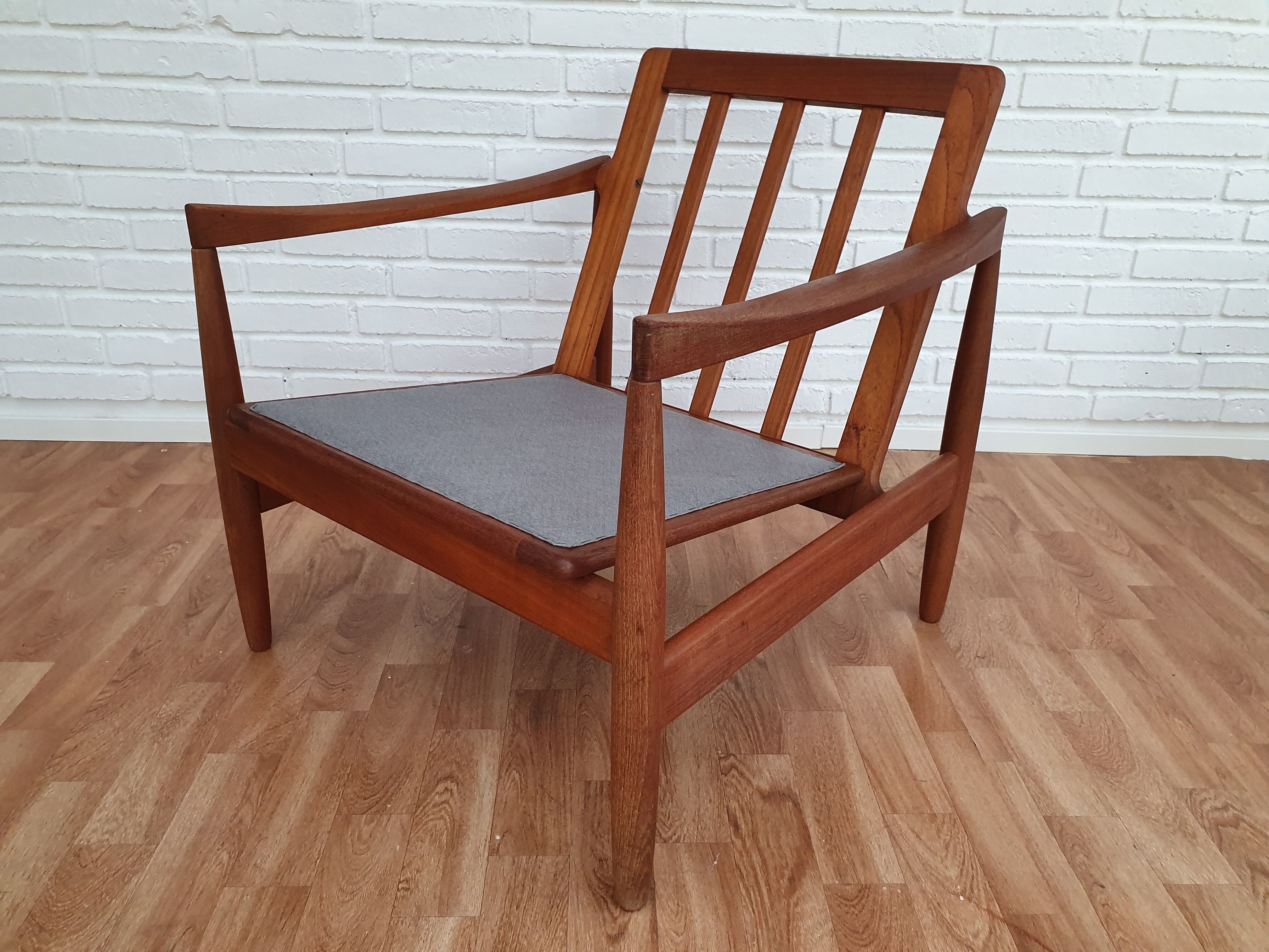 A pair of Danish armchairs, teak, wool, leather