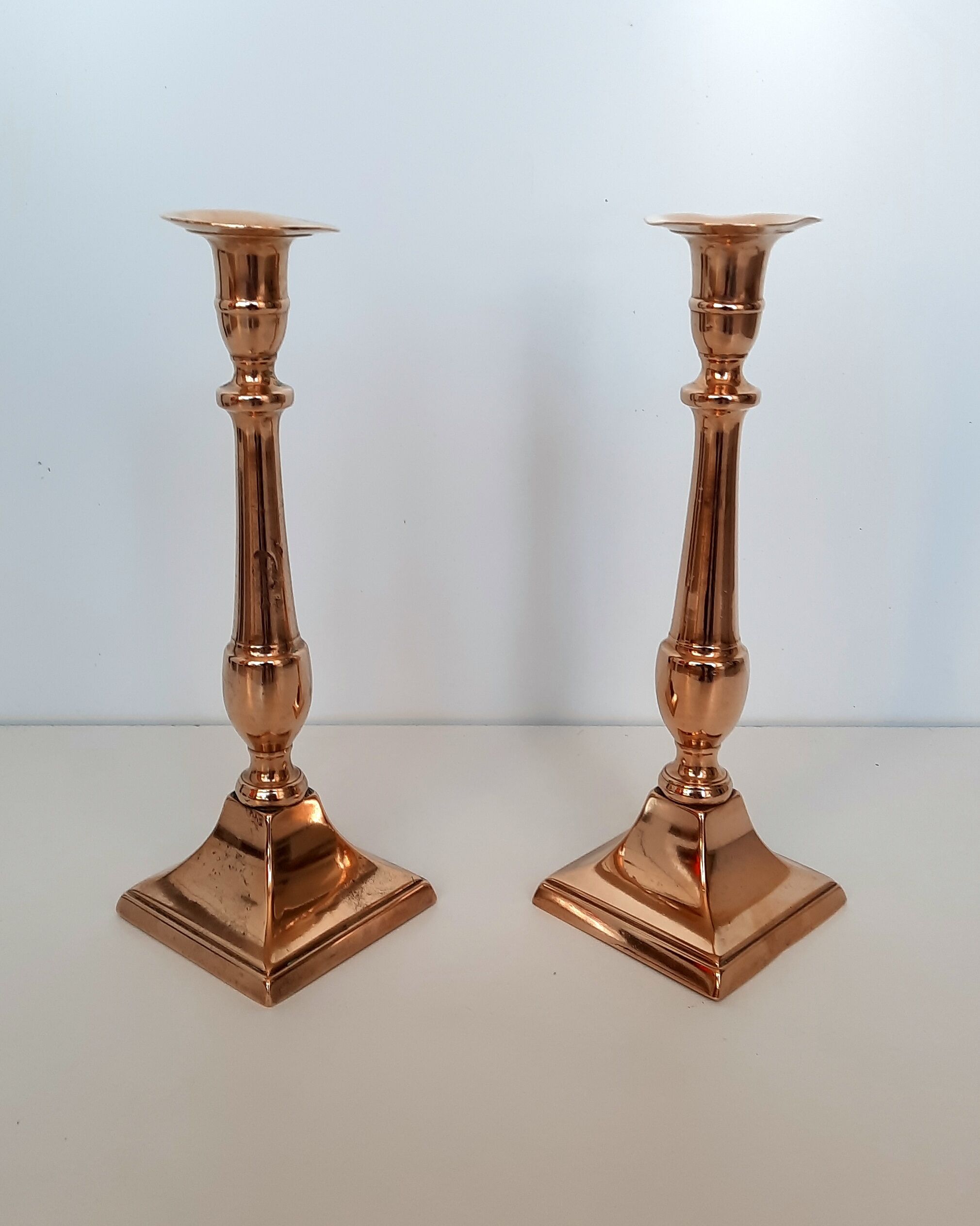 Pair of square foot copper candle holders