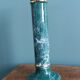 Column candle holder in ceramic with green and gold marble effect.