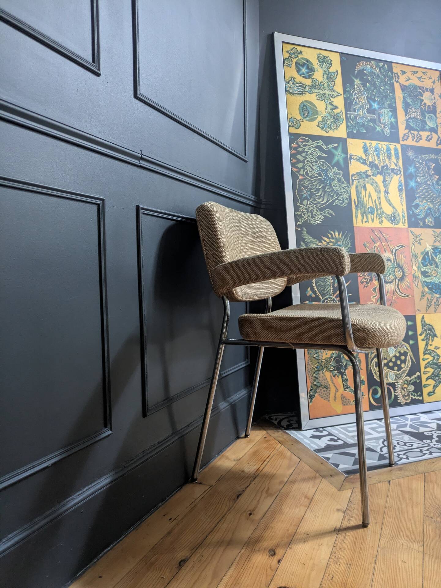 vintage tubular metal chrome office chair with patterned fabric.
