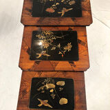 Series of three nesting tables, lacquer decorated with trendy birds and marquetry. circa 1900
