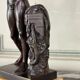 Dionysus on the shoulders of a satyr, bronze after the antique on a yellow Siena base.